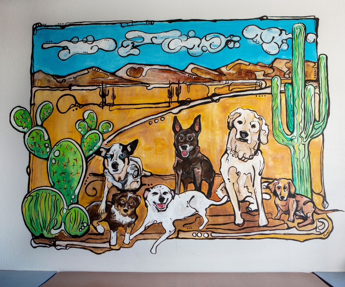 a painting of dogs and cactus